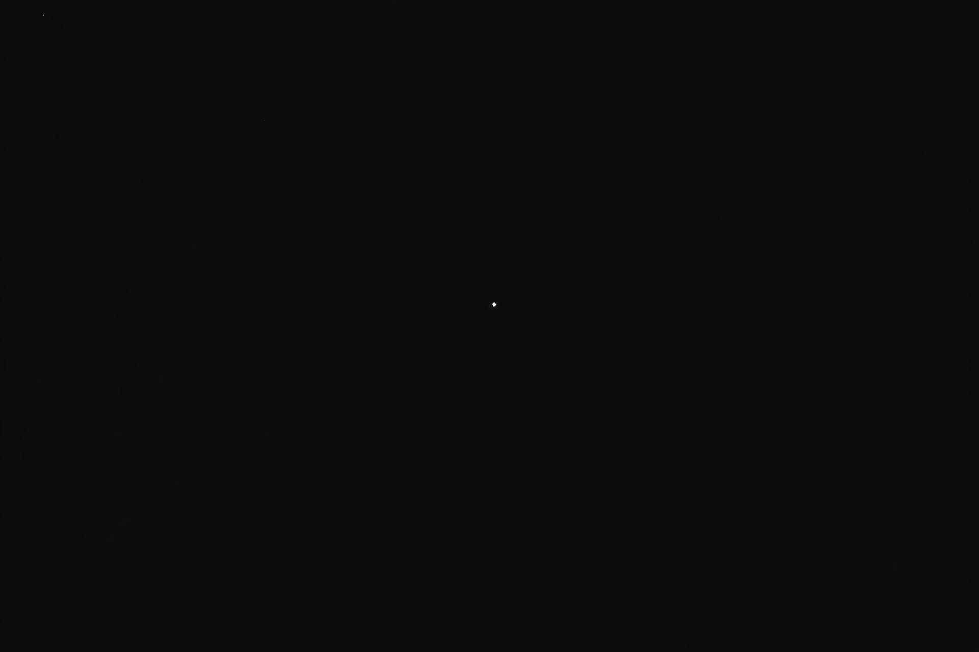 Nearly total darkness with a single faint star