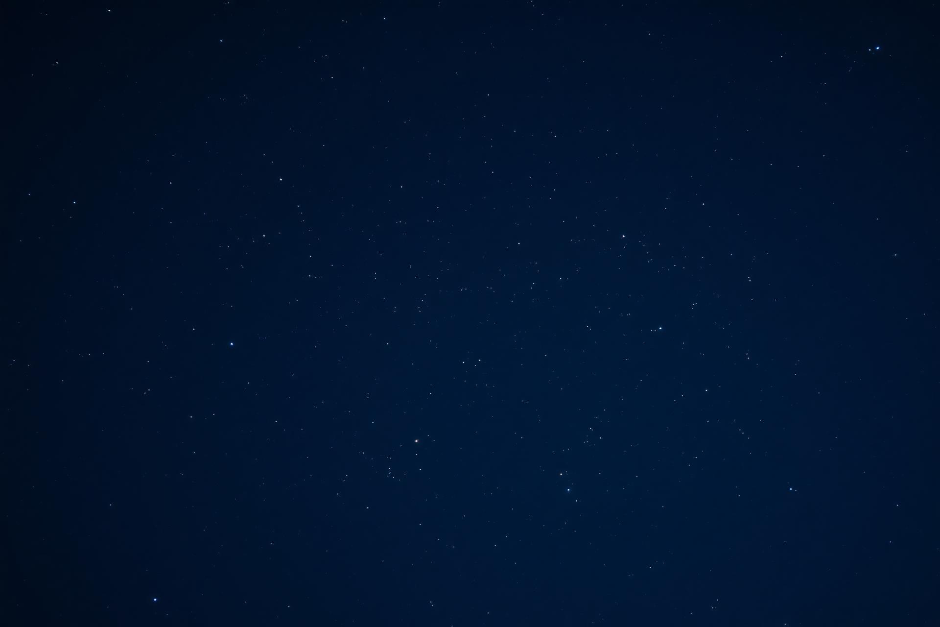 An open night sky filled with soft stars